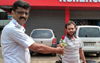 Rose for Helmetless Riders - Puttur Police Gandhigiri